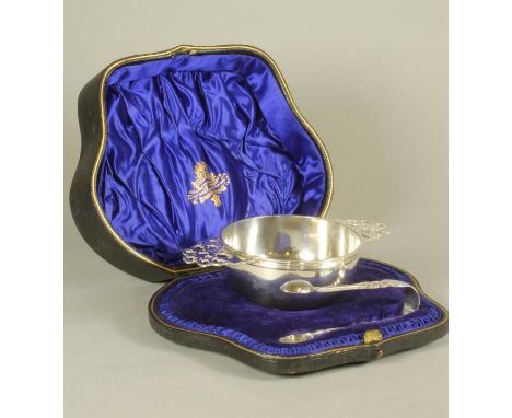 A LATE VICTORIAN SILVER SUGAR BASIN, maker Wakely & Wheeler, London 1899, in the form of a quaiche with scroll pierced lug ha