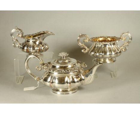 AN OLD SHEFFIELD PLATE THREE PIECE TEA SERVICE, early 19th century, of lobed squat globular form with stamped and filled acan