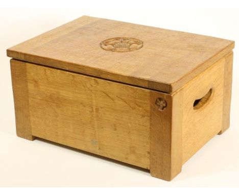 A MALCOLM PIPES ADZED OAK BOX of oblong form, the hinged lid centred by a carved Yorkshire Rose, pierced loop side handles an