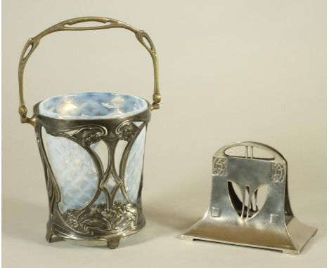 AN ART NOUVEAU WMF ICE BUCKET, the pale opaque dimpled glass liner supported in a flared cylindrical frame with overhead swin