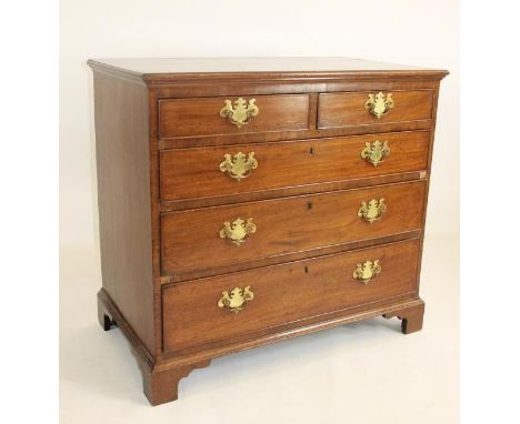 A GEORGIAN MAHOGANY CHEST, late 18th century, the moulded and banded top over two short and three long drawers with brass dro