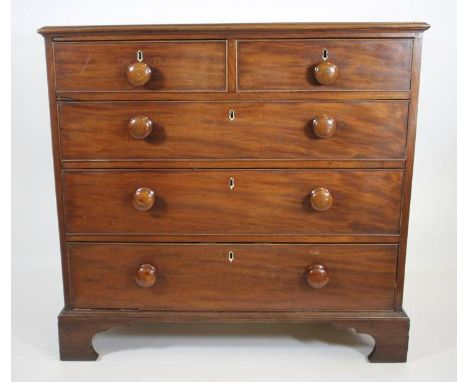 A GEORGIAN MAHOGANY CHEST, late 18th century, the moulded edged top over two short and three long cockbeaded drawers with lat
