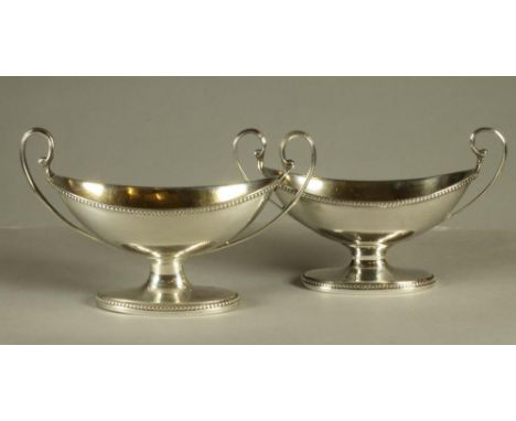 A COMPOSITE PAIR OF GEORGE III SILVER SALTS, maker Robert Hennell, London 1785, and makers R & S Hennell, London 1804, of two