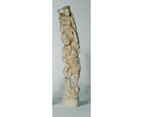 A JAPANESE ONE PIECE IVORY OKIMONO, Meiji period, of a fisherman supporting a young child standing on his left shoulder weari