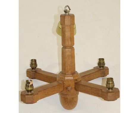 A MALCOLM PIPES ADZED OAK LIGHT PENDANT, cruciform with four lights, the moulded and faceted stem with acorn pendant, carved 