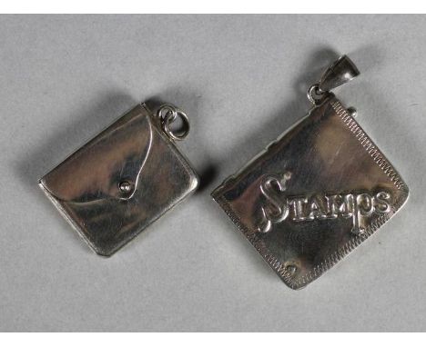 TWO STERLING SILVER STAMP HOLDERS, one as an envelope with hinged flap and hanging ring, the other repousse with "Stamps" wit