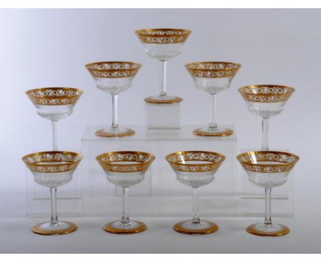 A SET OF TEN ST LOUIS CRISTAL CHAMPAGNE SAUCERS, 20th century, in thistle pattern with gilded scrolling rosette rims, 5" high