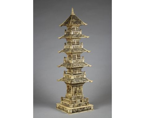 A JAPANESE IVORY PAGODA, early 20th century, of five tiers with a buddha shrine to the base, 18 1/2" high