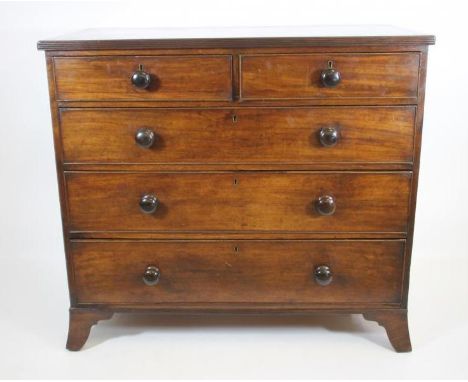 A REGENCY MAHOGANY CHEST, the reeded edged top over two short and three long cockbeaded drawers with turned wood handles, mou
