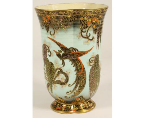 A CROWN DEVON FIELDINGS POTTERY VASE, 1930's, of trefoil section on a low foot printed and painted in jewelled enamels with p