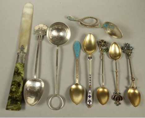 TWO ARTS AND CRAFTS SILVER PRESERVE SPOONS, stamped "Solid Silver", both with deeply planished bowls, one with plain ring ter