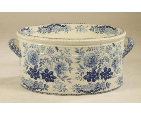 A VICTORIAN SPODE EARTHENWARE FOOTBATH, of two handled staved oval form, printed in underglaze blue with flowers, printed SPO