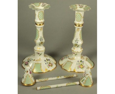 A PAIR OF HALCYON DAYS BILSTON ENAMEL TAPERSTICKS, modern, the fixed shaped drip pans issuing from baluster stems and lobed b
