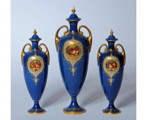 A ROYAL WORCESTER CHINA COMPOSITE THREE PIECE MANTEL GARNITURE, 1928/29,30, each two handled slender ovoid vase with lift-off