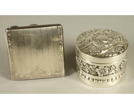 A LATE VICTORIAN SILVER BOX AND COVER, maker Samuel Jacob, Birmingham 1900, of plain cylindrical form, all over chased and re