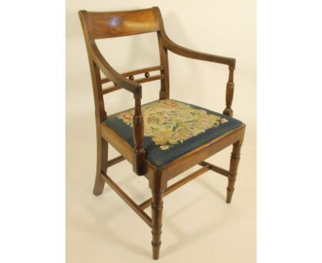A GEORGIAN MAHOGANY ELBOW CHAIR, early 19th century, the reeded back with curved top rail having ebony strung inlay, bar and 