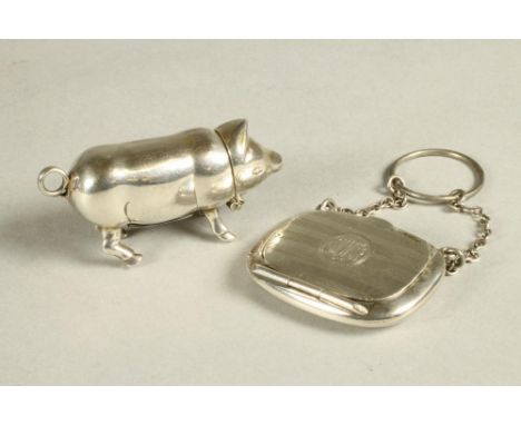 A SILVER MINIATURE COMPACT, maker's mark indistinct, Chester 1918, of plain rounded oblong form with engine turned stripes en