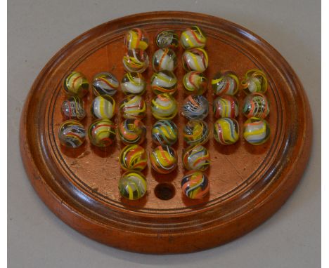 A vintage solitaire set with 32 vintage hand-made marbles