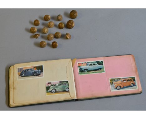 15 North Staffordshire Regimental buttons, by J. R. Gaunt & Son. Together with an album containing various cigarette cards in