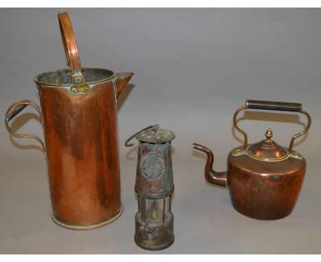 A copper kettle, watering can and a Protector's Lamp & Lighting  Eccles Manchester.Davey Lamp 