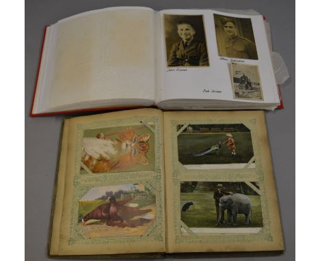 An interesting Victorian/ Edwardian postcard album with period examples together with a album containing various WW1 era port