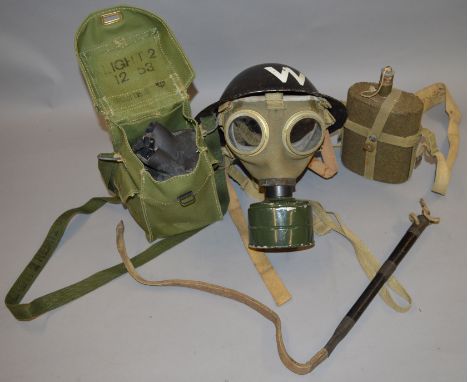 A WW2 Wardens helmet marked "W" together with a WW1 water canteen and 2 gas masks (4) 
