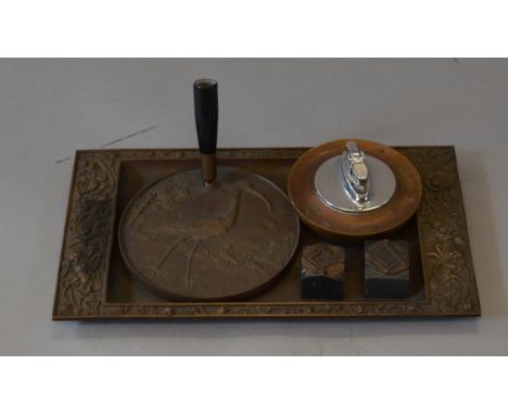 A Bronze table lighter, tray and pen stand, all marked A. Cohen & Co. Together with two Masonic metal stamps (5)