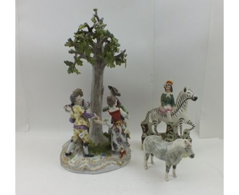 A GERMAN MEISSEN PORCELAIN FIGURE GROUP, four children in 18th century costume, dancing around a tree, on gilded scroll work 