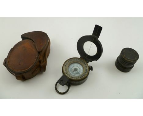 A SECOND WORLD WAR ISSUE COMPASS, black lacquered brass case, T.G & Co Ltd London, No.B59873, 1940 Mk III in leather case, to