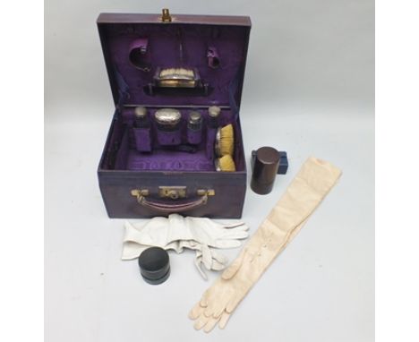 A LATE VICTORIAN / EDWARDIAN LAVENDER LEATHER TRAVELLING VANITY CASE, contains silver mounted items, opera glasses, a 'Dixon'