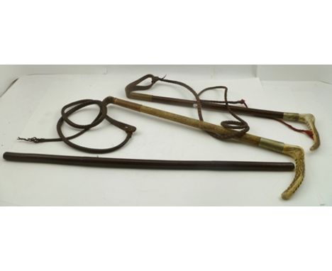 A "SWAINE" HUNTING CROP, together with TWO OTHER CROPS and a BULL NOSE LEAD CLIP (4) 