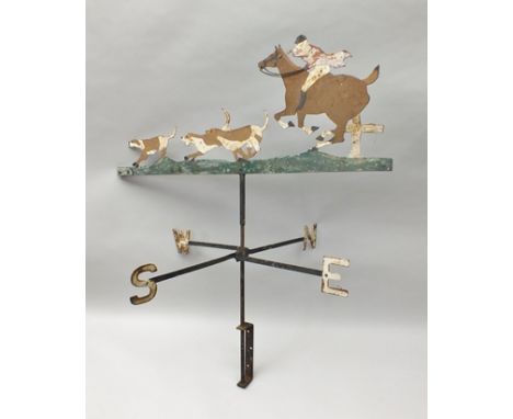 A WROUGHT METAL WEATHER VANE in the form of the hunt with huntsman and hounds, width 77cm 