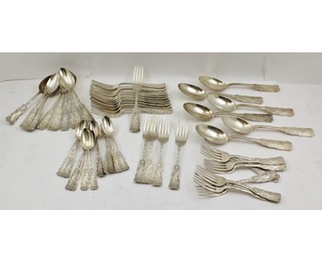 A QUANTITY OF AMERICAN WHITE METAL FLATWARE, decoratively cast, comprising six table spoons and ten of each dessert spoons, t