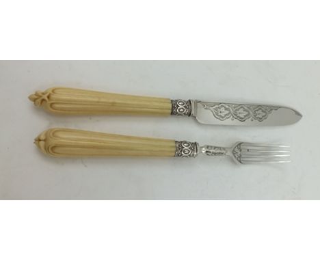 A VICTORIAN SILVER BLADED CAKE KNIFE AND FORK, chased decoration, Sheffield 1865 