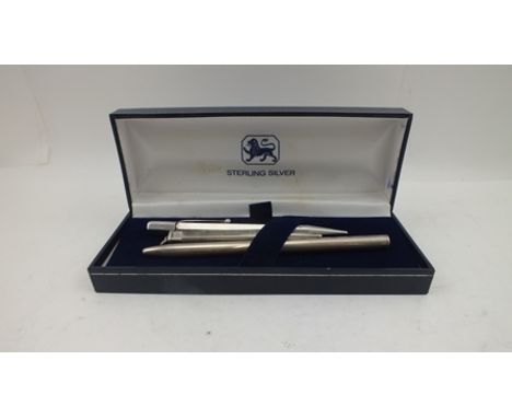 A SILVER CASED BALLPOINT PEN and TWO SILVER PROPELLING PENCILS (3) 