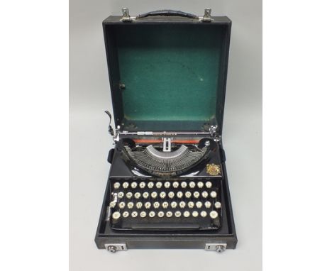 AN 'IMPERIAL' MANUAL TYPEWRITER, black finish with Royal warrant Coat of Arms transfer, in black carry case, 31cm 