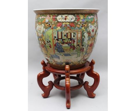 A JAPANESE CERAMIC FISH BOWL, polychrome painted with reserves of flowers, birds and courtly figures, goldfish painted to int