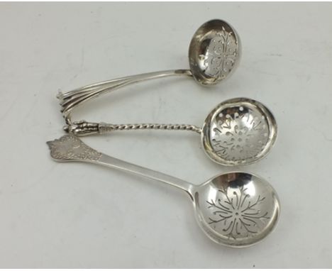 THOMAS BRADBURY & SONS A SILVER SUGAR SIFTING SPOON, Sheffield 1923, together with TWO SILVER SUGAR SIFTING LADLES, combined 