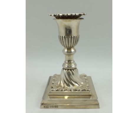 HAWKSWORTH, EYRE & CO. A VICTORIAN SILVER PIANO CANDLESTICK with removable wrythen drip pan, raised on squared stepped base, 
