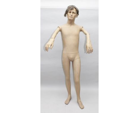A MALE SHOP DISPLAY MANNEQUIN with jointed arms, height approx.1.8m 