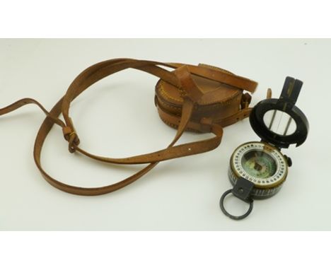 A WORLD WAR II BLACK PAINTED BRASS MILITARY COMPASS, 'T G Co Ltd', London, No.102278, 1941 Mk III' in leather case with shoul