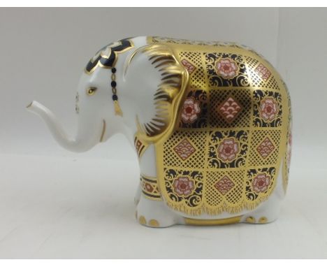 A ROYAL CROWN DERBY PAPERWEIGHT, "The Yorkshire Rose Elephant" no. 429/500, having raised trunk, gold stopper, 15cm wide, box