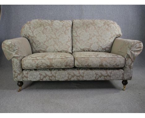 Sofa, contemporary Victorian style on mahogany turned supports terminating in brass cup casters. H.100 W.180 D.98cm. 