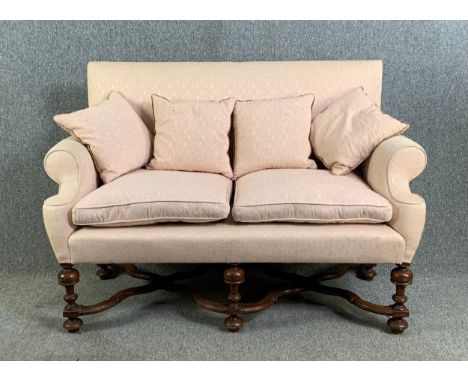 A two seater William and Mary style sofa on walnut turned and stretchered supports. H.105 W.149 D.62cm 