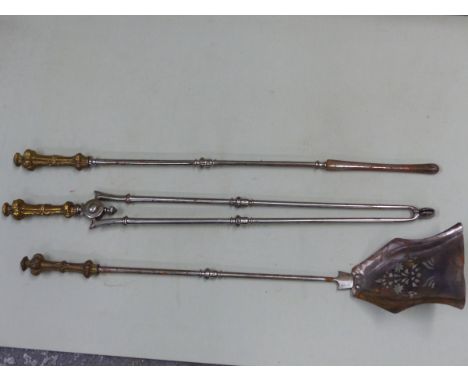 A SET OF 19TH CENTURY STEEL FIRE TOOLS WITH DECORATIVE CAST BRASS HANDLES, THE POKER 82 CM LONG