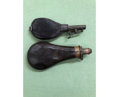 AN ANTIQUE LEATHER PERCUSSION GUN SHOT FLASK TOGETHER WITH A FURTHER ANTIQUE ADJUSTABLE MEASURE GUN POWDER FLASK. 