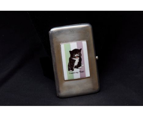 A silver cigarette/card case with applied enamel panel depicting a seated kitten with inscription "I want my vote" (reference