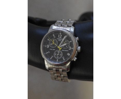A Tissot 1853 PRC 200 stainless steel Chronometer wristwatch, with three subsidiary dials and yellow hands; plus a date calen