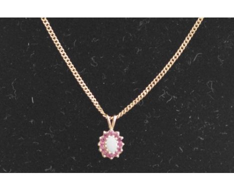 A 9ct gold, opal and pink sapphire set pendant necklace with a 9ct gold chain. Approximate weight 5 grams.