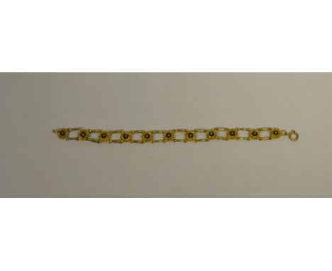 A silver gilt and enamel flower bracelet